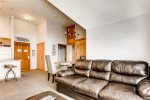 Open living and dining area with an additional murphy bed